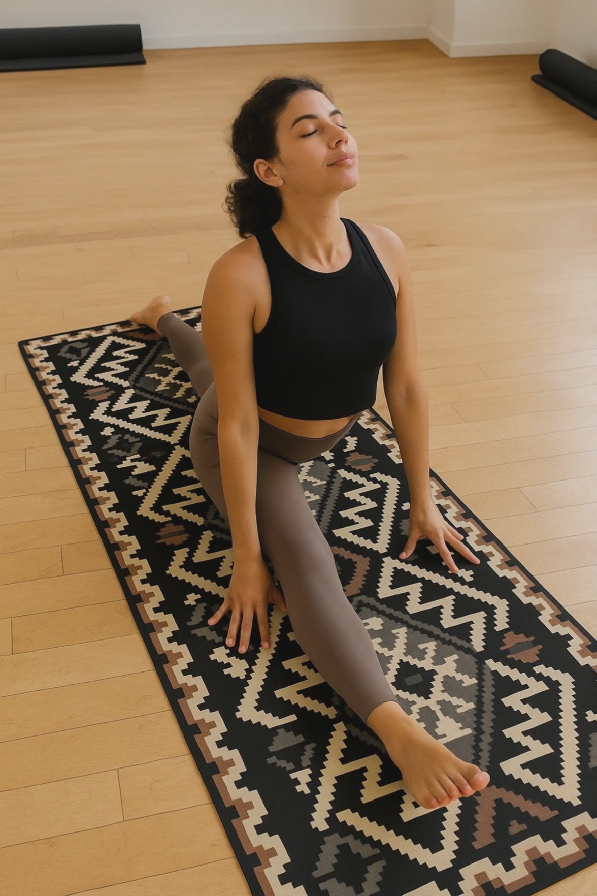 woman doing yoga on a foldable mat
